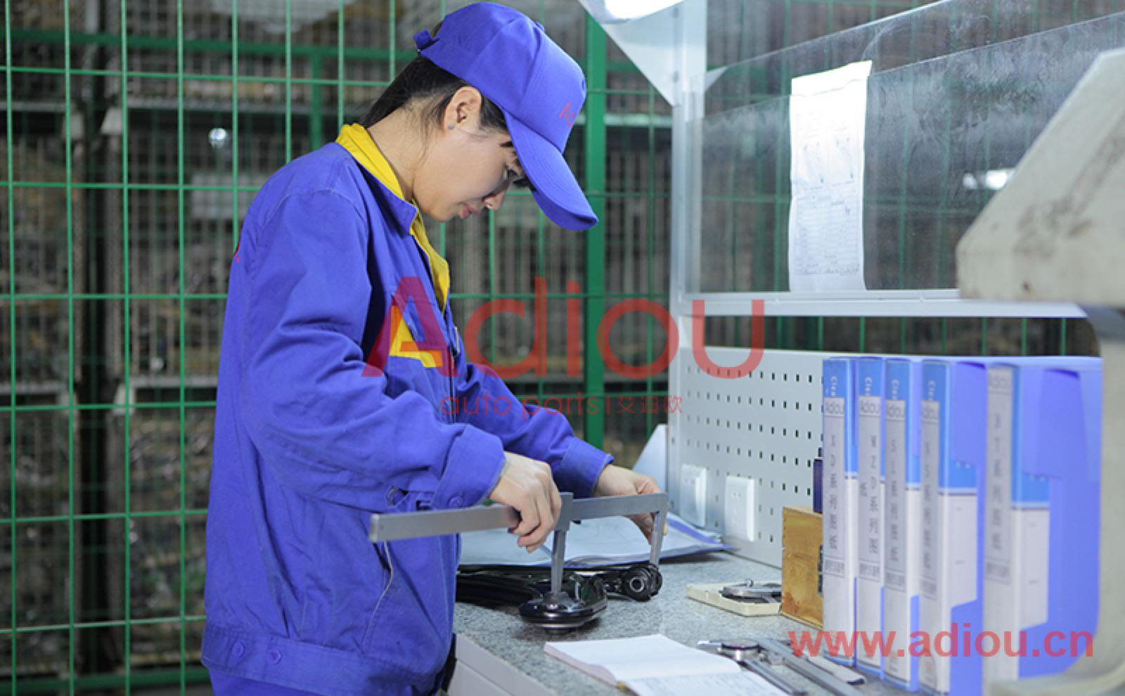 Inspector checking control arms at the end of the line